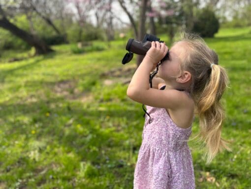 Girl using the 6.5×32 Explore Binoculars